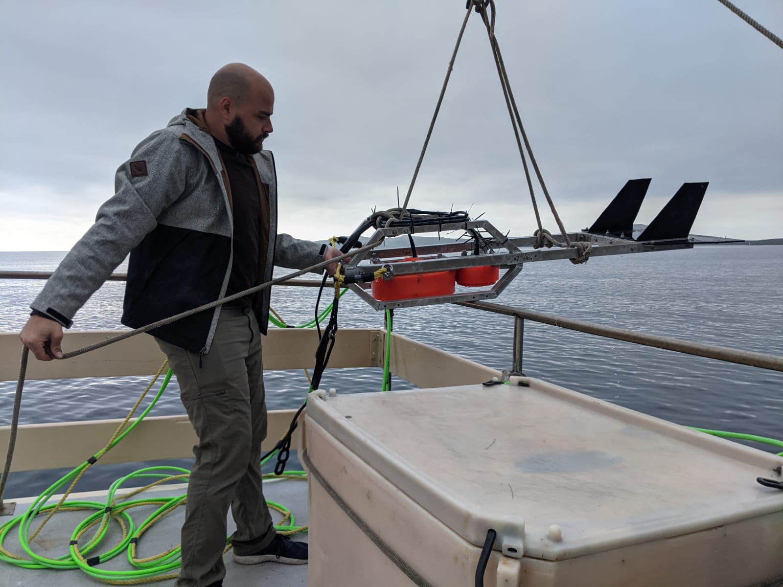Tucker deploying towed active acoustic array to collect prey data. Photo courtesy of Nicholas Tucker