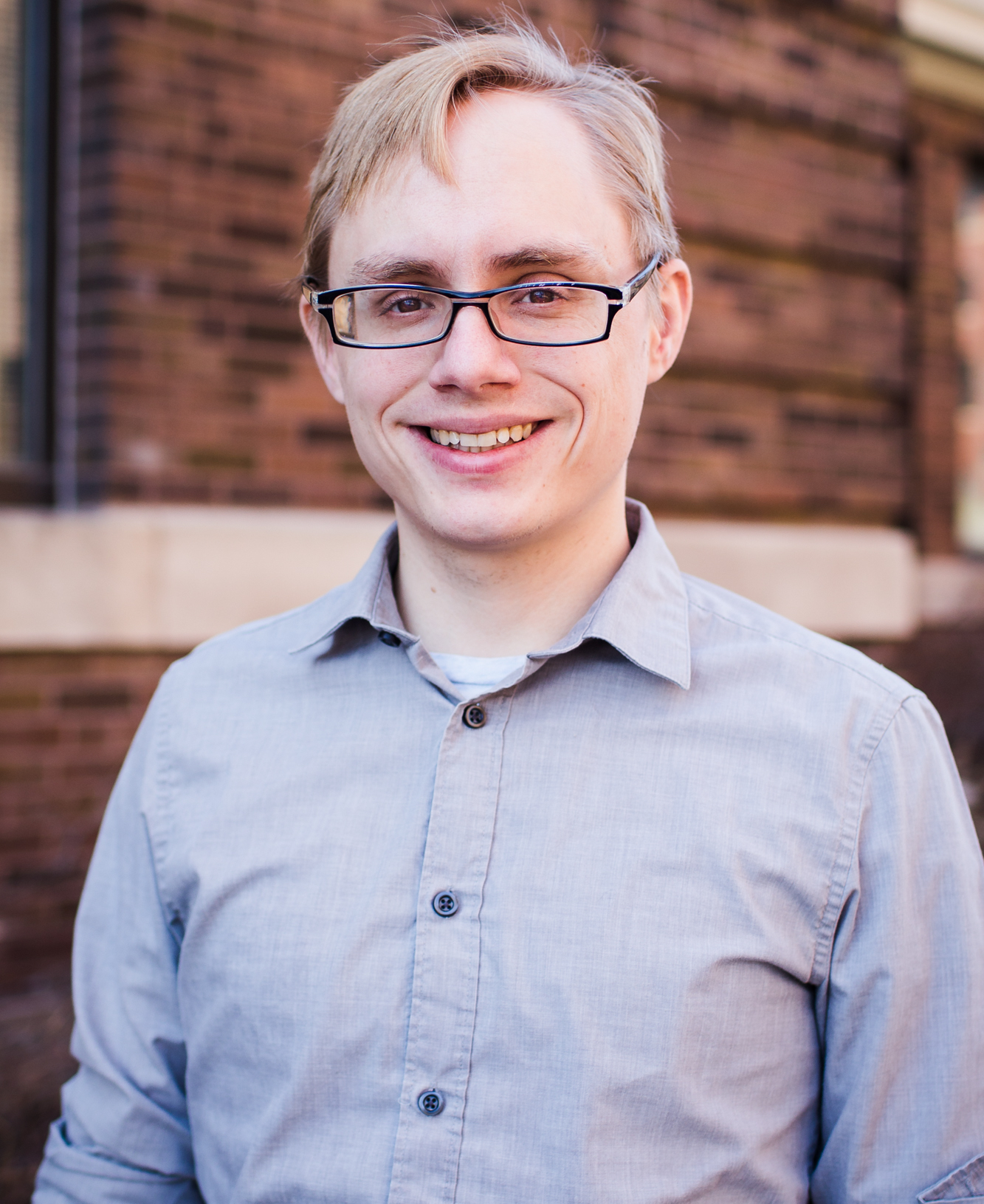 man with glasses smiling