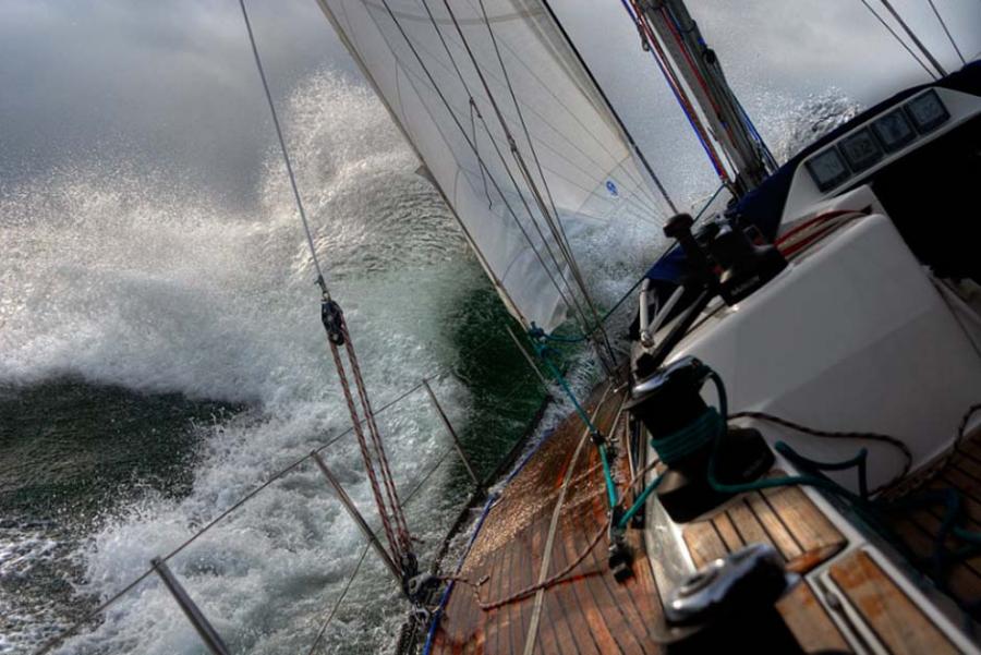 heeled over sailboat