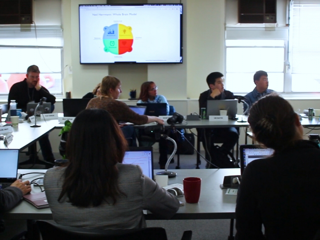 researchers discussing in meeting room