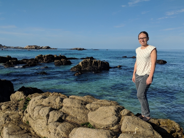 Julie Lowndes on the rocks by the sea