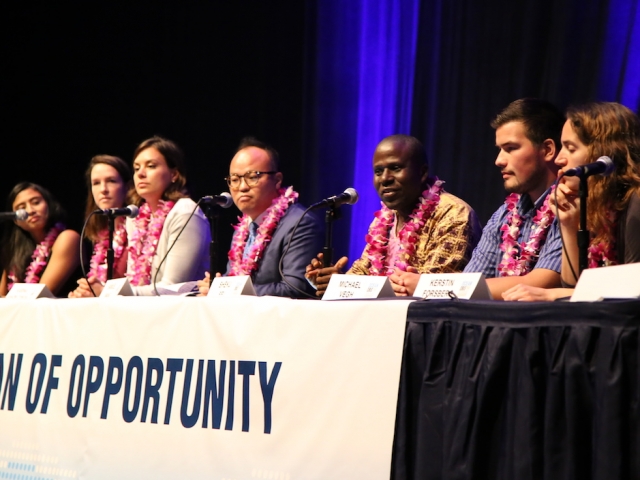 a panel of people at a table