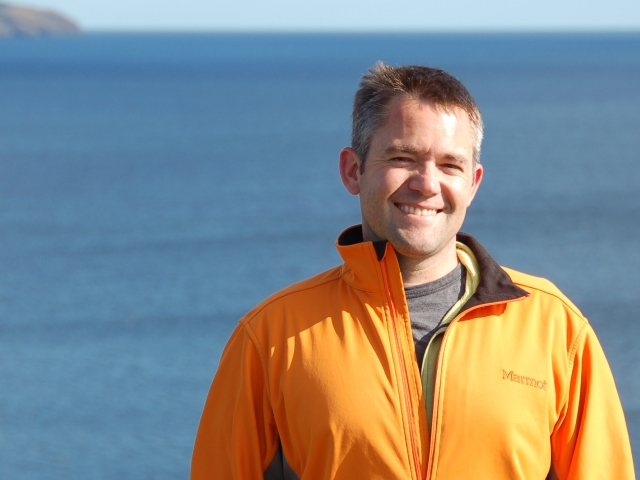 Eric Ward standing in front of water