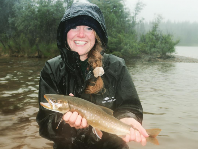 woman holding a fish