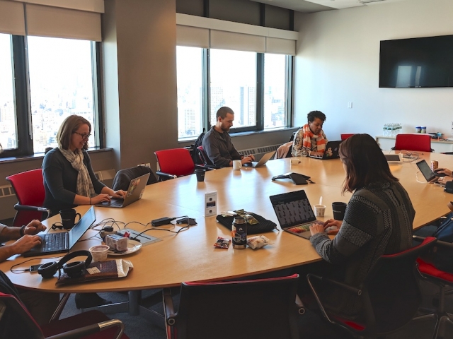 MOZ science fellows around a conference table