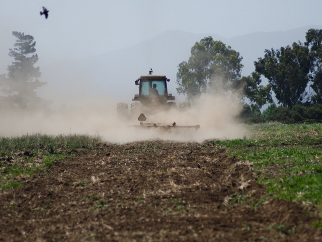 a tractor plowing the field