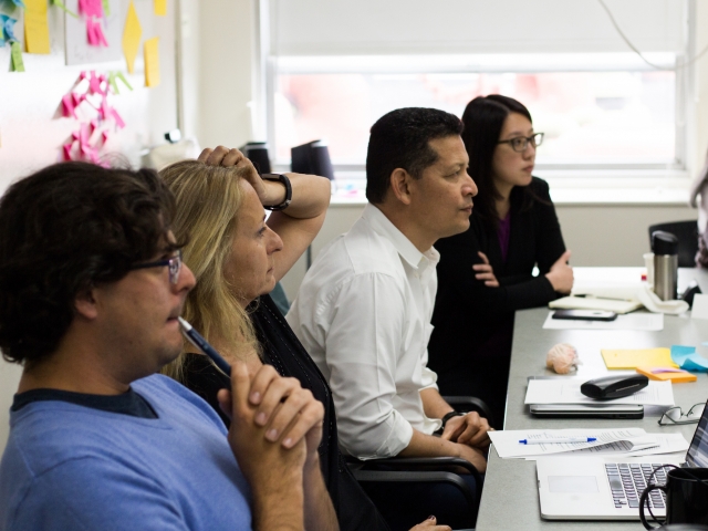 People in conference room looking forward