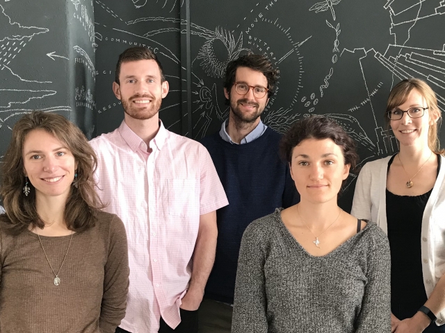 Seven people posing for photo