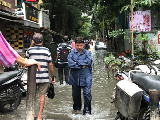 People walking in a flooded street