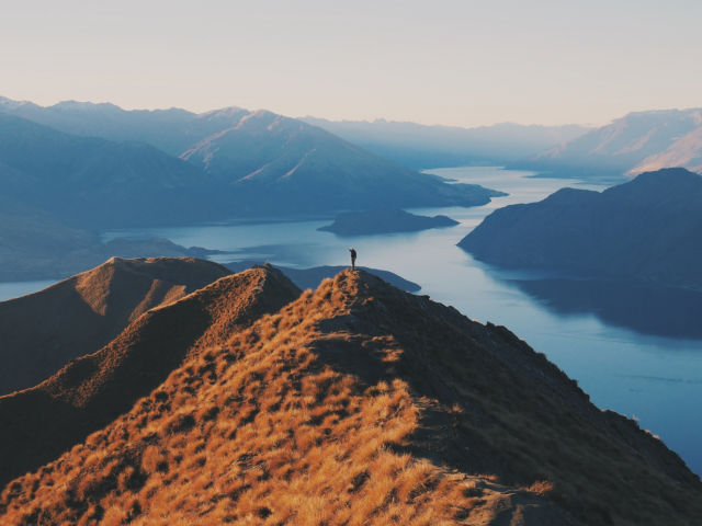 Person on mountain looking at the horizon