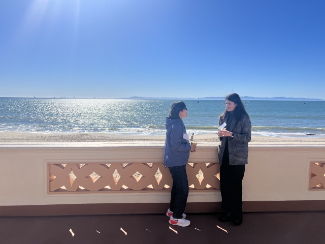 Two scientists on the beachside patio at EDS 2023 in Santa Barbara 