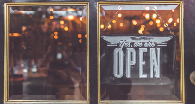 Open sign hanging in window