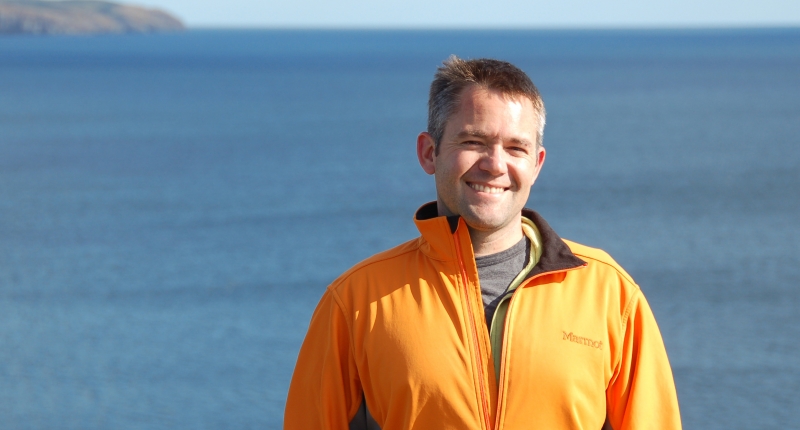 Eric Ward standing in front of water