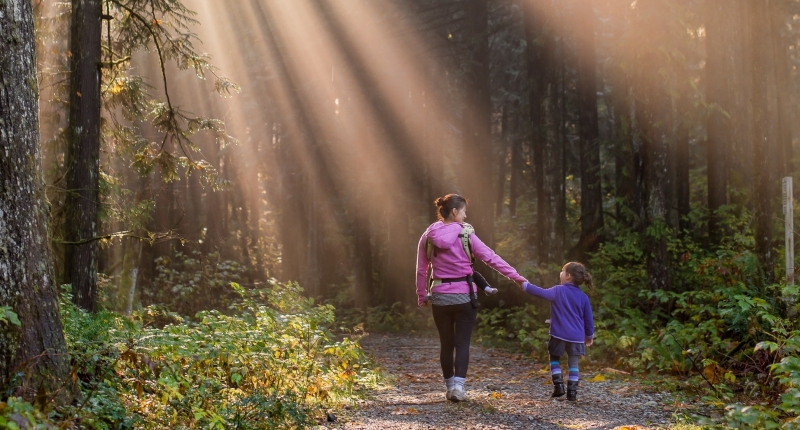 mom and daughter holding hands