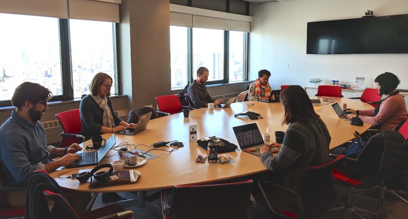 MOZ science fellows around a conference table