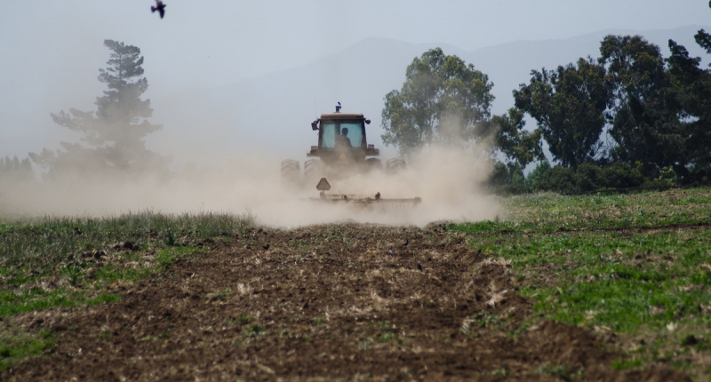 a tractor plowing the field