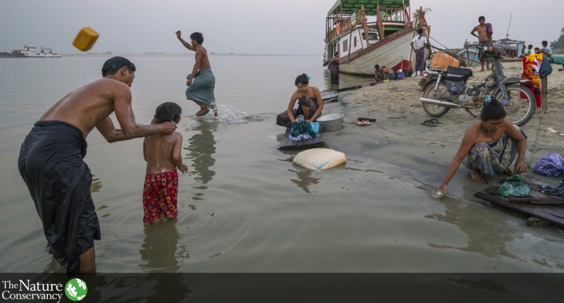 People bathing and washing in a river