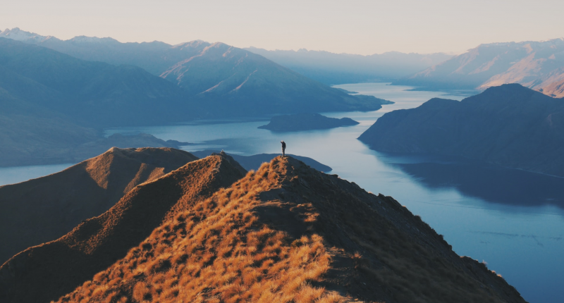 Person on mountain looking at the horizon