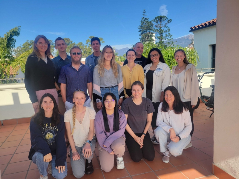 The participants and instructors of our October 2024 coreR course gathered in two rows on the NCEAS terrace at the end of their five days of training on R programming, open science, and reproducible data.