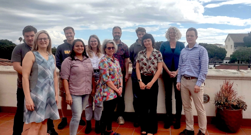 A group of peope stand on the NCEAS terrace.